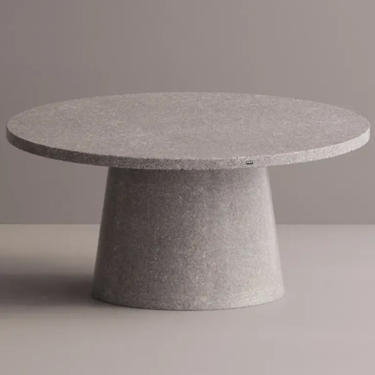Luxury Round Pedestal Dining Table in Tan matte stone-look with speckled top by Luxury Group International