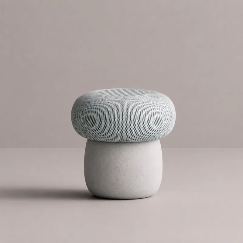 Luxus Runder Blauer Gepolsterter Hocker mit Skulpturalem Weißem Betonfuß Featured Image von Luxury Group International