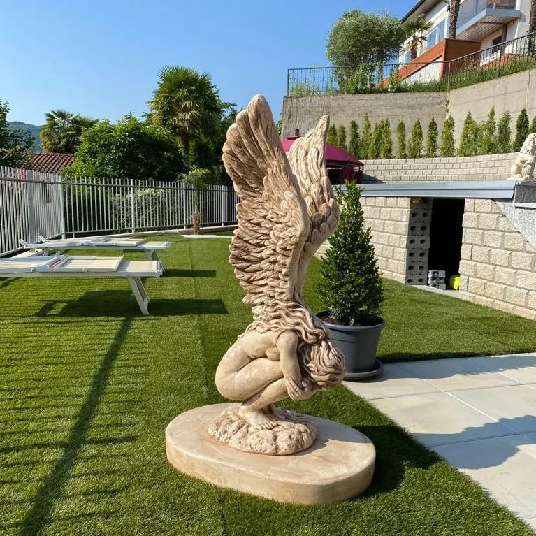 Luxury Marble Winged Garden Sculpture with Raised Feathered Wings in Natural Stone Finish Front View by Luxury Group International