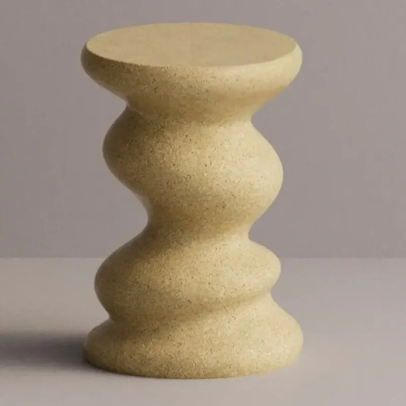 Luxury sculptural concrete side table with wavy scalloped design - Luxury hotel furniture by Luxury Group International