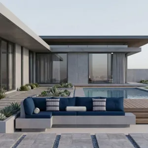 Blaues Luxus L-förmiges Betonsofa mit Polstersitz und geometrischem Design – Gartenmöbel Lifestyle-Ansicht von Luxury Group International