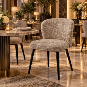 Boucle Fabric Dining Chair with Black Metal Legs and Curved Backrest - Luxury Hotel Furniture Lifestyle View by Luxury Group International