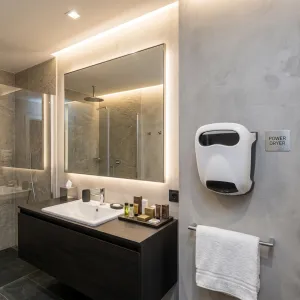 Compact Luxury Automatic Hand Dryer with Eco-Jet Technology in White & Grey Color Variations Lifestyle View by Luxury Group International