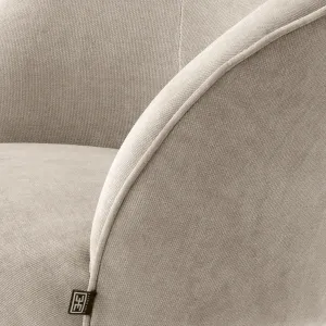 Cream Fabric Lounge Armchair with Curved Backrest and Black Metal Base - Luxury Hotel Furniture Detail View by Luxury Group International