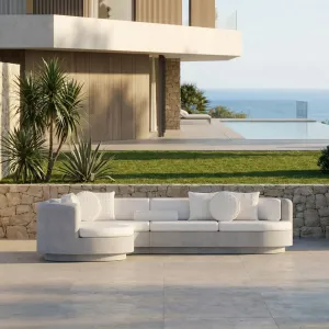 Grey Luxury Concrete L-Shaped Sofa with Left Curved Chaise - Outdoor Furniture Lifestyle View by Luxury Group International