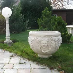 Large Decorative Garden Planter with Sculpted Face Motifs - Luxury Planters Lifestyle View by Luxury Group International