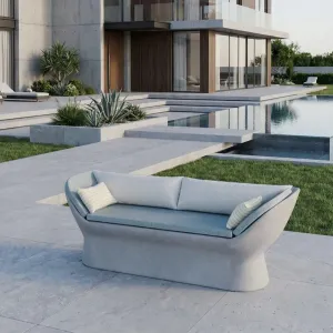 Light Grey Luxury Concrete Outdoor Sofa with Teal Blue Upholstery - Outdoor Furniture Lifestyle View by Luxury Group International