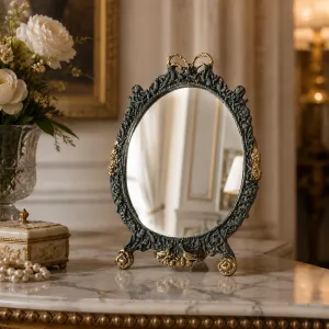 Luxus Barock Ovaler Tischspiegel mit Verziertem Schleifenaufsatz und Skulptiertem Bronze-Rahmen Lifestyle-Ansicht von Luxury Group International