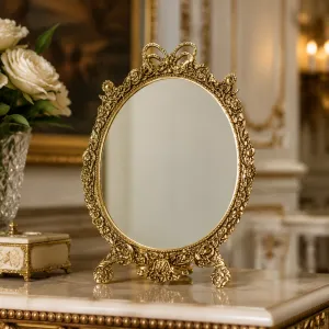 Luxus Barock Ovaler Tischspiegel mit Verziertem Schleifenaufsatz und Skulptiertem Bronze-Rahmen Lifestyle-Ansicht von Luxury Group International