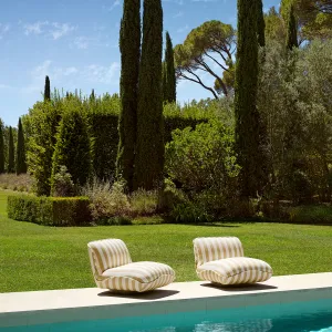 Luxury Beige and White Striped Armless Lounge Chair with Curved Seat and Round Base Lifestyle View by Luxury Group International