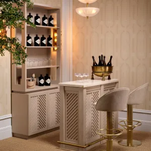 Luxury Beige Bar Cabinet with Chevron Doors & Golden Foot Rail – 131 cm - Luxury Hotel Furniture Lifestyle View by Luxury Group International