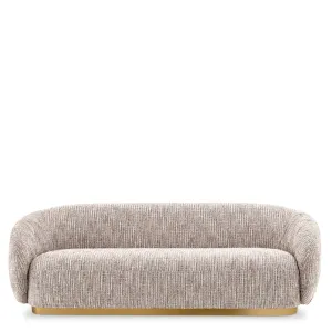 Sofá Curvo Tapizado Beige de Lujo con Base Metálica Dorada - Sofá de Lujo Vista frontal por Luxury Group International