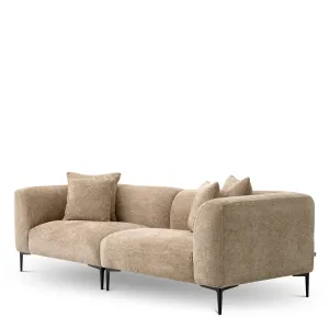 Sofá tapizado beige de lujo con patas de metal negro - Mobiliario de hotel de lujo Vista lateral por Luxury Group International