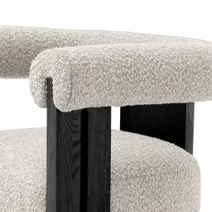 Modern Boucle Armchair with Black Wooden Frame and Rounded Upholstered Design - Luxury Dining Chair Detail View by Luxury Group International