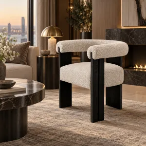 Modern Boucle Armchair with Black Wooden Frame and Rounded Upholstered Design - Luxury Dining Chair Lifestyle View by Luxury Group International