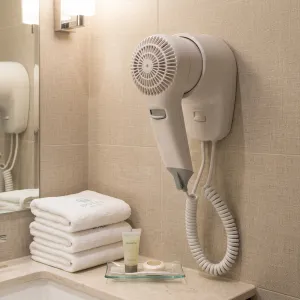 Luxury Compact Hotel Hair Dryer with Front Wall Mount & Safety Thermostat Lifestyle View by Luxury Group International