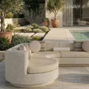 Luxury Contemporary Beige L-Shaped Sofa with Curved Chaise and Cream Cushions - Outdoor Furniture Lifestyle View by Luxury Group International