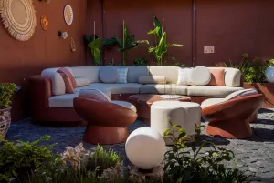 Luxury Contemporary Ruby Terracotta L-Shaped Sectional Sofa with Cream Cushions -Oudoor Furniture Lifestyle View by Luxury Group International