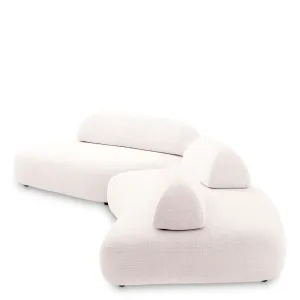 Canapé Modulaire Courbé Crème de Luxe avec Coussins de Dossier Sculpturaux - Mobilier de Luxe pour Hôtels Vue de côté par Luxury Group International