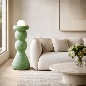 Luxury Designer Floor Lamp with Sculptural Stoneware Base and Glass Globe Lifestyle View by Luxury Group International