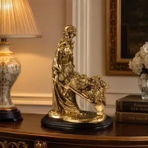 Luxury Garden Lady Bronze Sculpture with Flower-Filled Wheelbarrow in Golden & Silver Finish Lifestyle View by Luxury Group International
