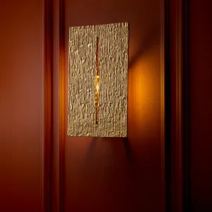 Luxury Gold Textured Wall Sconce with Vertical Design for Sophisticated Interiors Front View by Luxury Group International