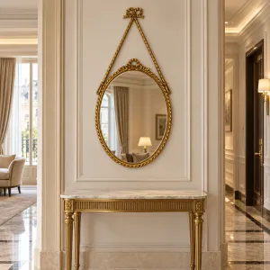 Luxury Golden Baroque Oval Wall Mirror with Ribbon Bow & Ornate Frame - Luxury Hotel Furniture Lifestyle View by Luxury Group International