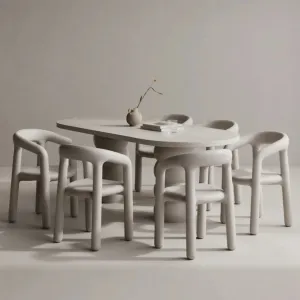 Luxury Grey Oval Concrete Dining Table with Sculptural Pedestal Base Lifestyle View by Luxury Group International