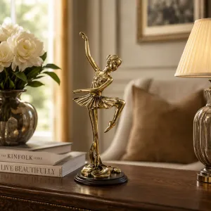 Luxury High-Pose Ballerina Bronze Sculpture in Golden Finish on Wooden Base - Luxury Bronze Figure Lifestyle View by Luxury Group International