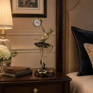 Luxury High-Pose Ballerina Bronze Sculpture with Raised Clock on Wooden Base - Luxury Bronze Figure Lifestyle View by Luxury Group International