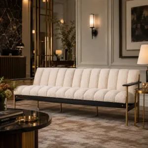 Luxury Ivory Channel-Tufted Sofa with Black Wood & Brass Frame - Luxury Hotel Furniture Lifestyle View by Luxury Group International