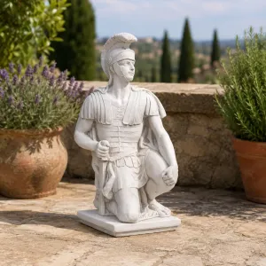 Luxury Kneeling Roman Centurion Garden Sculpture with Crested Helmet - Luxury Classic Sculpture Lifestyle View by Luxury Group International