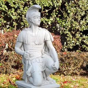 Luxury Kneeling Roman Centurion Garden Sculpture with Crested Helmet - Luxury Classic Sculpture Lifestyle View by Luxury Group International