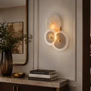 Luxury Layered Glass Disc Wall Light with Antique Brass Finish Lifestyle View by Luxury Group International