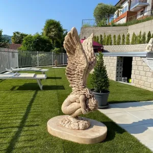 Luxury Marble Winged Garden Sculpture with Raised Feathered Wings in Natural Stone Finish Front View by Luxury Group International