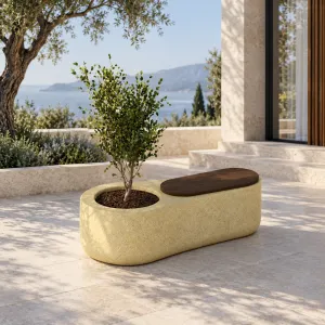 Luxury Pastel Yellow Oval Outdoor Planter with Integrated Dark Wooden Seating Lifestyle View by Luxury Group International