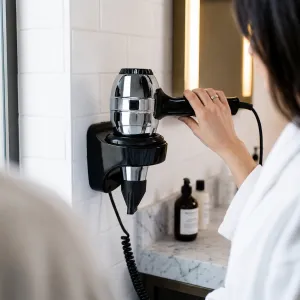Luxury Professional Hotel Hair Dryer with Vertical Wall Base & Stainless Steel Body Lifestyle View by Luxury Group International