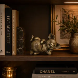 Luxury Reclining Pig Bronze Sculpture with Playful Expression - Luxury Bronze Figure Lifestyle View by Luxury Group International