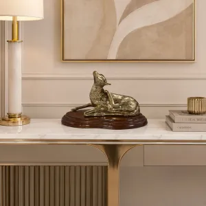 Luxury Resting Deer Bronze Sculpture on Polished Wooden Base Lifestyle View by Luxury Group International