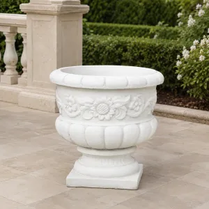 Luxury Round Garden Planter with Sculpted Floral Relief and Pedestal Base Lifestyle View by Luxury Group International