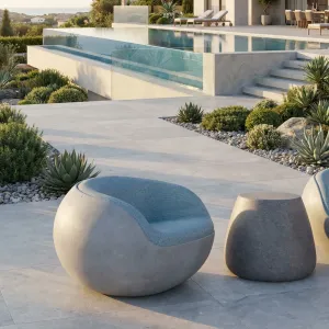 Luxury Sculptural Accent Chair in Light Gray Matte Concrete with Teal Blue Inner Cushion Front View by Luxury Group International