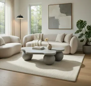 Table Basse Sculpturale en Béton de Luxe au Design Organique Moderne Vue lifestyle par Luxury Group International
