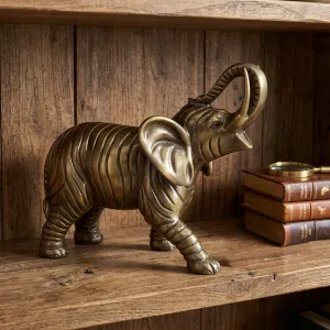 Luxus Bronze-Skulptur eines schreitenden Elefanten mit hochgerolltem Rüssel in Gold- und Antikbronze-Finish Lifestyle-Ansicht von Luxury Group International