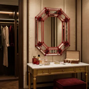 Luxury Venetian Style Octagonal Red Glass Wall Mirror with Floral Etched Frame & Starburst Accents Lifestyle View by Luxury Group International
