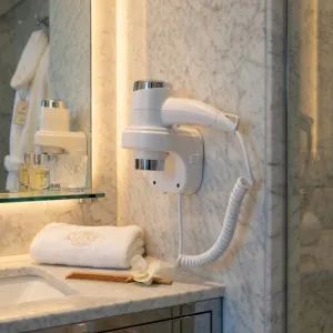 Luxury Wall Mounted Hotel Hair Dryer with Vertical Docking Base in Chrome Finish Lifestyle View by Luxury Group International