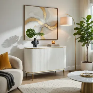 Luxury White Fluted Sideboard with Double Door Storage Cabinet in Brushed Gold Accents Lifestyle View by Luxury Group International