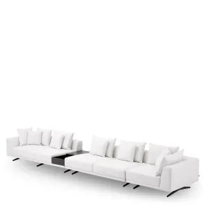 Canapé d'angle blanc de luxe avec table d'appoint intégrée et pieds en métal noir - Mobilier de luxe pour hôtels Vue de côté par Luxury Group International