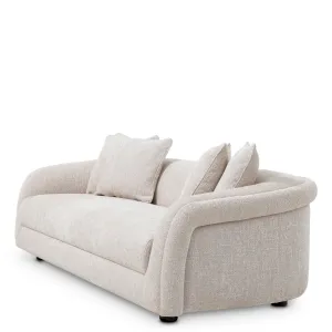 Modern Cream Upholstered Sofa with Curved Arms and Deep Cushioned Seat - Luxury Hotel Furniture Side View by Luxury Group International