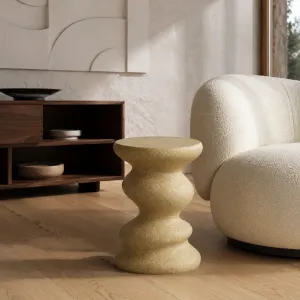 Luxury sculptural concrete side table with wavy scalloped design - Luxury hotel furniture Lifestyle View by Luxury Group International