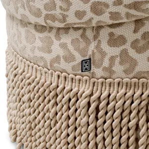 Round Beige Upholstered Stool with Patterned Fabric and Decorative Fringe - Luxury Hotel Furniture Detail View by Luxury Group International